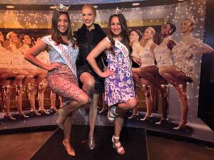 (left) Jessica Brosofsky poses and (right) Meghan Sinisi pose with a wax figure of a Rockette at Madame Tussauds in New York. 