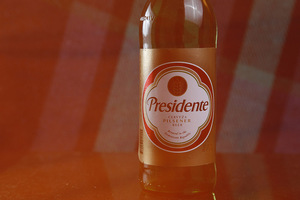 Presidente has a lovely golden color and notes of pears, apples and other fruity, tropical flavors. The aftertaste has a hint of corn. 