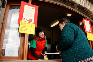 Hanah Ehrenreich (left) takes the order of a customer, Judy Oplinger, at the 24th Annual Chili Bowl Festival. Funds from the festival will be used to restore Thornden Park.